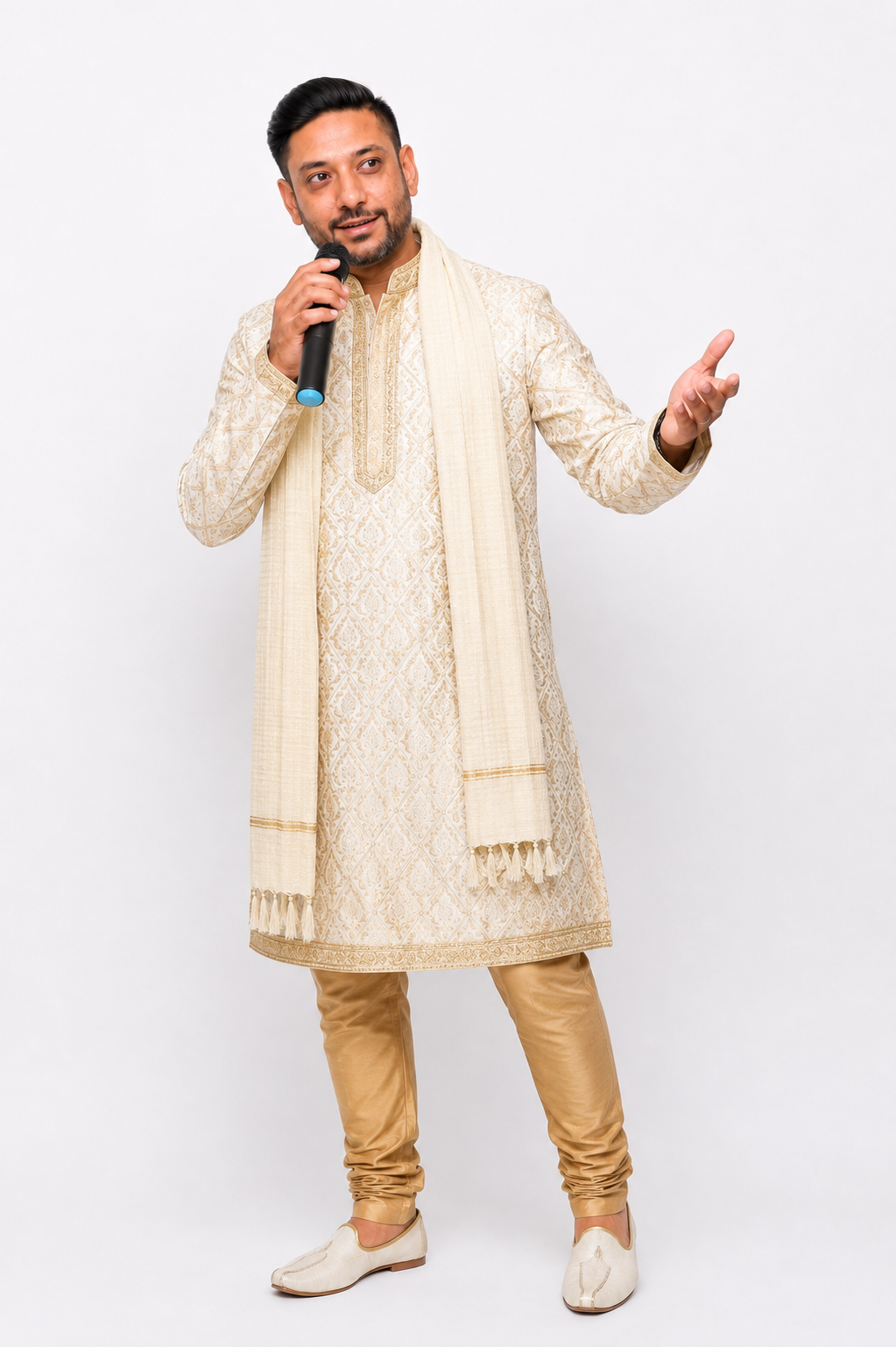 Vipul Nagnesia performing with a microphone in an ivory and gold embroidered kurta